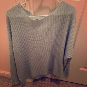 Slouchy sweater. Wooden ship